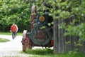 Old steam engine in the open-air museum with old farmhouses and buildings in GroÃÅ¸gmain in Salzburg